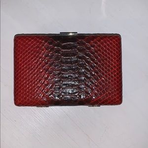 Red snake skin clutch